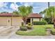 Villa exterior with a tile roof, two-car garage, and well-maintained landscaping at 3617 Yellow Pine Ct # 144, Sarasota, FL 34238