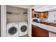Convenient laundry area near the kitchen, featuring modern washer and dryer at 3617 Yellow Pine Ct # 144, Sarasota, FL 34238