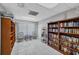 Cozy library featuring built-in bookshelves, tile floors, and comfortable seating at 3617 Yellow Pine Ct # 144, Sarasota, FL 34238