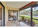 Inviting screened patio with seating offers a peaceful outdoor living space and neighborhood views at 3617 Yellow Pine Ct # 144, Sarasota, FL 34238