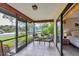 Relaxing screened patio provides views of the lush landscaping and nearby tennis courts at 3617 Yellow Pine Ct # 144, Sarasota, FL 34238