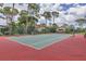 Enjoy a match on this tennis court, surrounded by trees and landscaping at 3617 Yellow Pine Ct # 144, Sarasota, FL 34238
