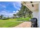 Relaxing backyard patio with manicured lawn and mature shade trees at 3721 Somerville Dr # 1513, Sarasota, FL 34232