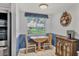 Cozy breakfast nook area with natural lighting and view to backyard at 3721 Somerville Dr # 1513, Sarasota, FL 34232