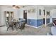 Bright dining area with casual seating and view into kitchen at 3721 Somerville Dr # 1513, Sarasota, FL 34232