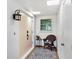 Bright entryway featuring a cozy seat, a small table, and ample natural light at 3721 Somerville Dr # 1513, Sarasota, FL 34232