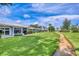 Beautiful lawn and landscaping create an inviting atmosphere around these light blue single-story homes at 3721 Somerville Dr # 1513, Sarasota, FL 34232