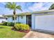 Inviting home exterior featuring lush landscaping and a well-maintained lawn at 3721 Somerville Dr # 1513, Sarasota, FL 34232