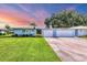 Charming single-story home with a well-manicured lawn, lush landscaping, and a two-car garage at 3721 Somerville Dr # 1513, Sarasota, FL 34232