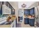 Well-equipped kitchen featuring modern appliances and dark wood cabinets for ample storage at 3721 Somerville Dr # 1513, Sarasota, FL 34232