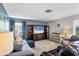 Comfortable living room featuring cozy seating, entertainment center, and soft natural lighting at 3721 Somerville Dr # 1513, Sarasota, FL 34232
