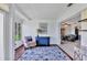 Stylish living room with wood floors, decor, and adjacent dining area at 3721 Somerville Dr # 1513, Sarasota, FL 34232