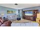 Inviting living room features comfortable seating, artwork, and a large entertainment center at 3721 Somerville Dr # 1513, Sarasota, FL 34232