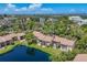 A tranquil pond and lush landscaping complements this condo community from an elevated view at 3810 75Th W St # 128, Bradenton, FL 34209