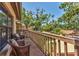 Inviting balcony with cozy seating, offering a relaxing outdoor space with lush greenery views at 3810 75Th W St # 128, Bradenton, FL 34209
