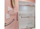 The bathroom features a shower with sliding glass doors and grab bars at 3810 75Th W St # 128, Bradenton, FL 34209