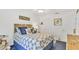 Charming bedroom featuring nautical decor, a fan, and closet storage at 3810 75Th W St # 128, Bradenton, FL 34209