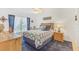Nautical themed bedroom with blue accents, ceiling fan, and natural wood furniture at 3810 75Th W St # 128, Bradenton, FL 34209