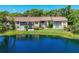 Scenic pond view enhances the appeal of this multi-unit condo complex surrounded by lush greenery at 3810 75Th W St # 128, Bradenton, FL 34209