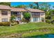 This condo has a spacious lawn and wooden balcony overlooking the serene water feature at 3810 75Th W St # 128, Bradenton, FL 34209