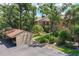 Exterior of the condo featuring lush landscaping, a well maintained building and parking at 3810 75Th W St # 128, Bradenton, FL 34209