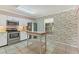 Charming kitchen featuring stainless steel appliances and an island at 3810 75Th W St # 128, Bradenton, FL 34209
