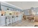 Bright kitchen bar area with stylish seating and shelving for decor at 3810 75Th W St # 128, Bradenton, FL 34209