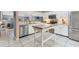 Bright kitchen with stainless steel appliances and a center island for food prep at 3810 75Th W St # 128, Bradenton, FL 34209