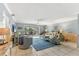 Bright living room with coastal decor, tile flooring, and seamless flow to the outdoor patio at 3810 75Th W St # 128, Bradenton, FL 34209