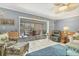 Inviting living room with coastal accents, cozy seating, and views of the screened lanai at 3810 75Th W St # 128, Bradenton, FL 34209