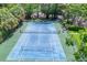 Well-maintained community tennis courts surrounded by lush landscaping and mature trees at 3810 75Th W St # 128, Bradenton, FL 34209