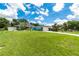 Beautiful single-story home with a well-manicured lawn and bright blue exterior paint at 3915 Meadow Creek Dr, Sarasota, FL 34233