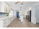 Spacious kitchen featuring white cabinetry, stainless steel appliances, and a breakfast bar island at 3915 Meadow Creek Dr, Sarasota, FL 34233
