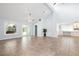 Bright living room with tile floors, ceiling fans, and large windows offering outdoor views at 3915 Meadow Creek Dr, Sarasota, FL 34233