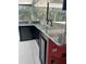 An elegant outdoor kitchen with granite countertops, stainless steel fixtures, and ample storage, perfect for entertaining at 3915 Meadow Creek Dr, Sarasota, FL 34233
