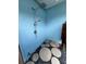 Refreshing outdoor shower with stone base and pebble accents, ideal for rinsing off after a swim at 3915 Meadow Creek Dr, Sarasota, FL 34233