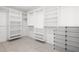 Walk-in closet with custom shelving, hanging rods, and ample storage space for an organized wardrobe at 3915 Meadow Creek Dr, Sarasota, FL 34233