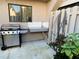 Outdoor area with a stainless steel grill, utility sink, and a small garden at 4001 Beneva Rd # 319, Sarasota, FL 34233