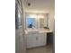 Bright bathroom features a white vanity, modern vessel sink, and ample lighting at 4001 Beneva Rd # 319, Sarasota, FL 34233