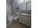 Beautifully updated bathroom with a shower-tub combo, updated vanity, and modern fixtures at 4001 Beneva Rd # 319, Sarasota, FL 34233