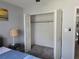 Bedroom with carpet, closet, and decor lamp near a picture at 4001 Beneva Rd # 319, Sarasota, FL 34233