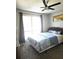 Bright bedroom with a ceiling fan, providing ample natural light and a comfortable space at 4001 Beneva Rd # 319, Sarasota, FL 34233