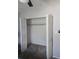 Spacious bedroom closet featuring white louvered doors and ample hanging space at 4001 Beneva Rd # 319, Sarasota, FL 34233