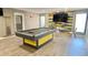 Spacious game room featuring a pool table, modern lighting, and stylish decor at 4001 Beneva Rd # 319, Sarasota, FL 34233