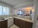 Open kitchen featuring granite countertops, modern appliances, and a view into the dining area at 4001 Beneva Rd # 319, Sarasota, FL 34233