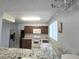 Modern kitchen with granite countertops, stainless steel appliances, and ample cabinet space at 4001 Beneva Rd # 319, Sarasota, FL 34233