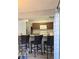 Kitchen featuring stainless steel appliances, granite countertops, and bar seating at 4001 Beneva Rd # 319, Sarasota, FL 34233