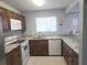 Modern kitchen boasts granite countertops, stainless appliances, and convenient dishwasher at 4001 Beneva Rd # 319, Sarasota, FL 34233