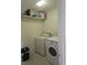 Laundry room with washer, dryer, and storage shelf at 4001 Beneva Rd # 319, Sarasota, FL 34233