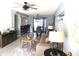 A well decorated living room with beachy decor and tile floors, and a combined living and dining area at 4001 Beneva Rd # 319, Sarasota, FL 34233